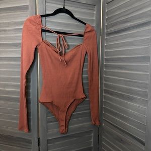 Tie back long sleeve body suit